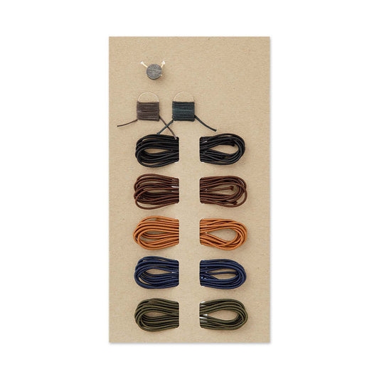 TRAVELER’S notebook 009 Repair Kit with elastic bands in black, brown, camel, blue and olive plus cords and tin fastener