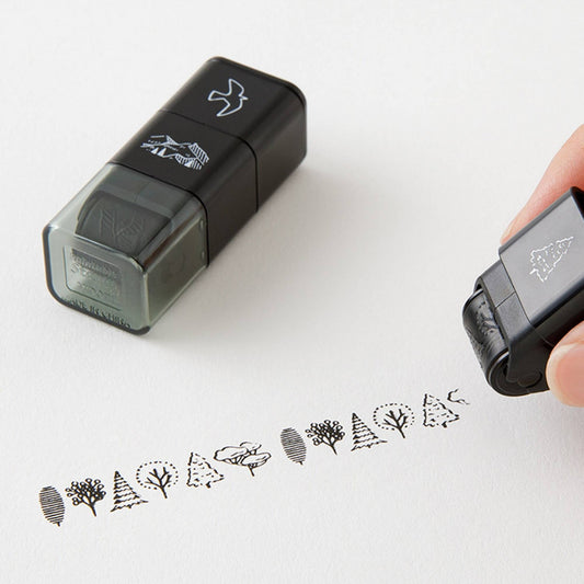 Midori roller stamp with mountain, tree and bird patterns, continuous pre-inked design, paintable Japanese stationery stamp