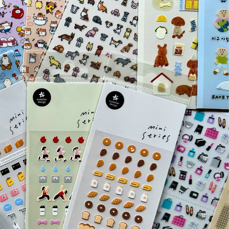 Colorful Korean and Japanese sticker sheets featuring cute animals, food, and characters for journaling and planners