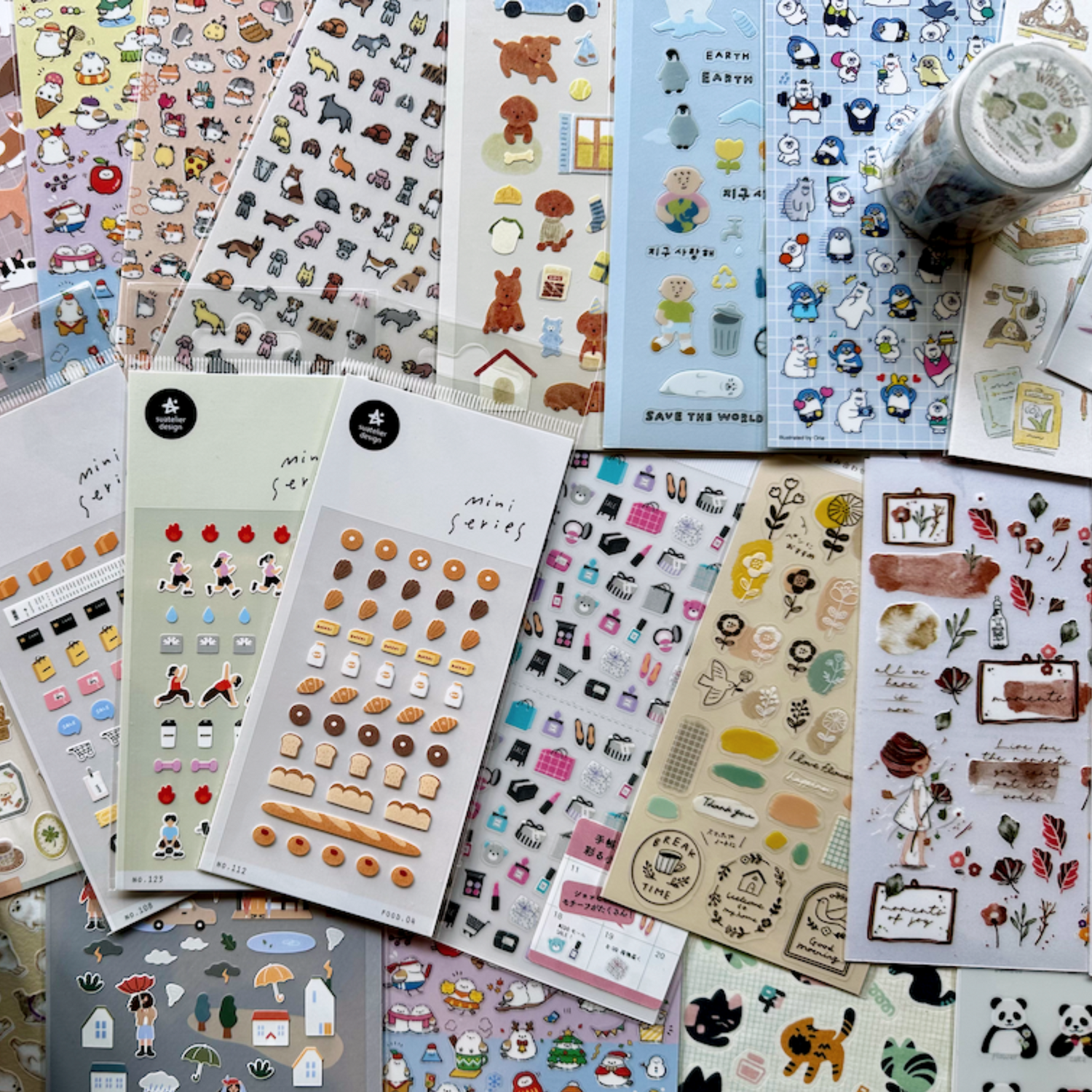 Colorful Korean and Japanese sticker sheets featuring cute animals, food, and characters for journaling and planners