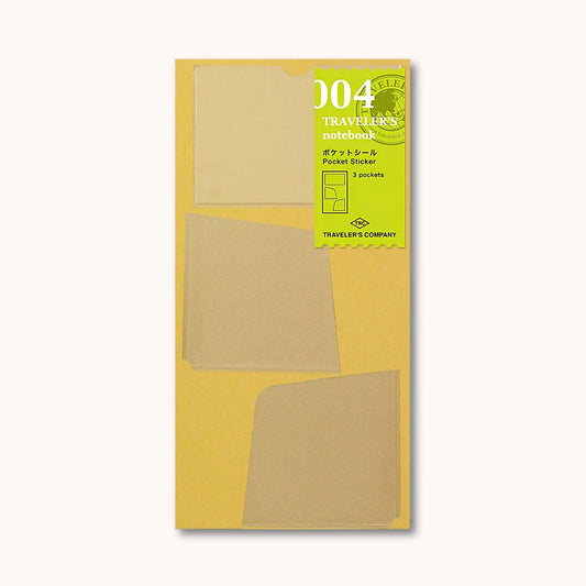 TRAVELER’S notebook self-adhesive pocket stickers with three clear PVC storage pockets for Regular Size notebooks.