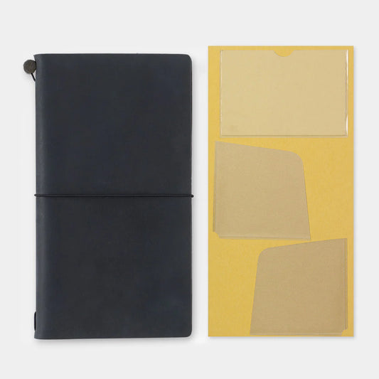 TRAVELER’S notebook self-adhesive pocket stickers with three clear PVC storage pockets for Regular Size notebooks.