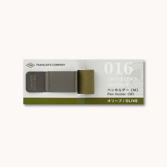 Olive green pen holder packaging with 'Traveler's Company' branding on a white background