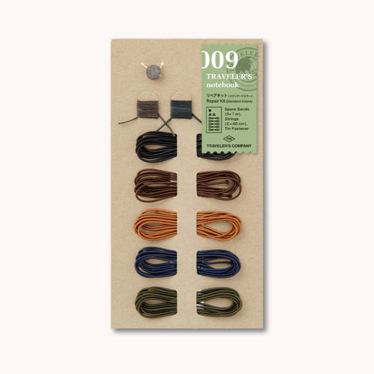 TRAVELER’S notebook 009 Repair Kit with elastic bands in black, brown, camel, blue and olive plus cords and tin fastener