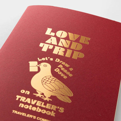TRAVELER’S notebook Love & Trip refill with red cover and gold foil dove design. Includes MD Cream Paper and perforated message cards.