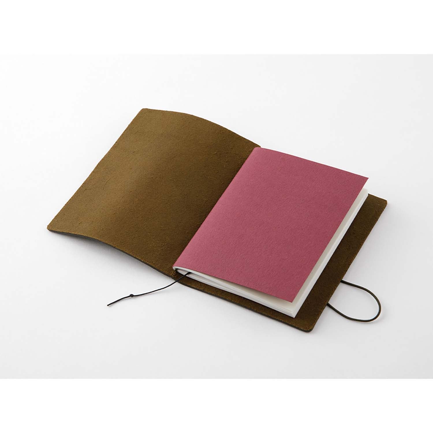 TRAVELER’S notebook in Olive – a dark brownish-green leather cover with earthy, rugged tones that deepen and develop a rich patina over time. Includes cotton bag, blank refill, and spare band.