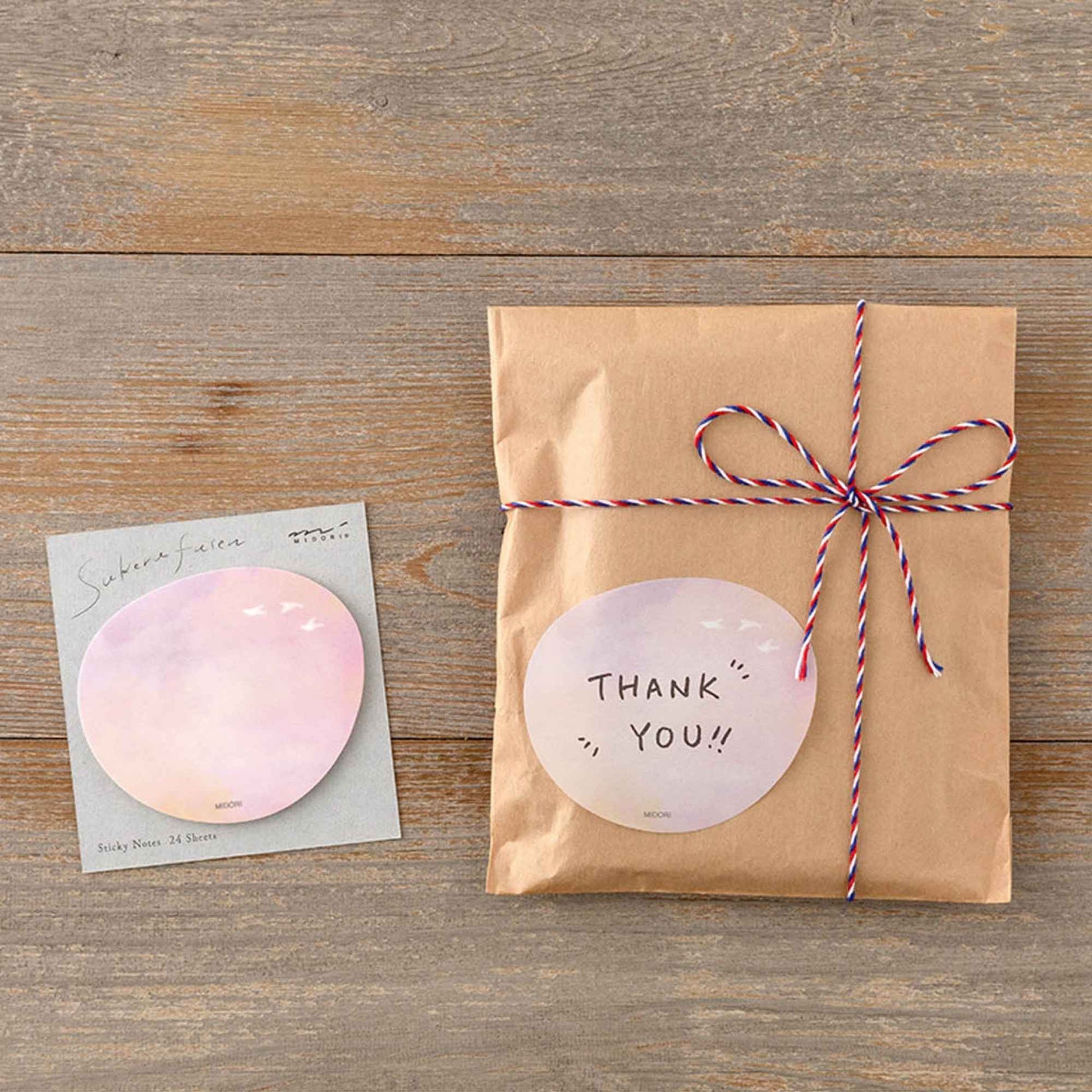 Midori Translucent Sticky Notes Sunset featuring a soft pink and peach sky design
