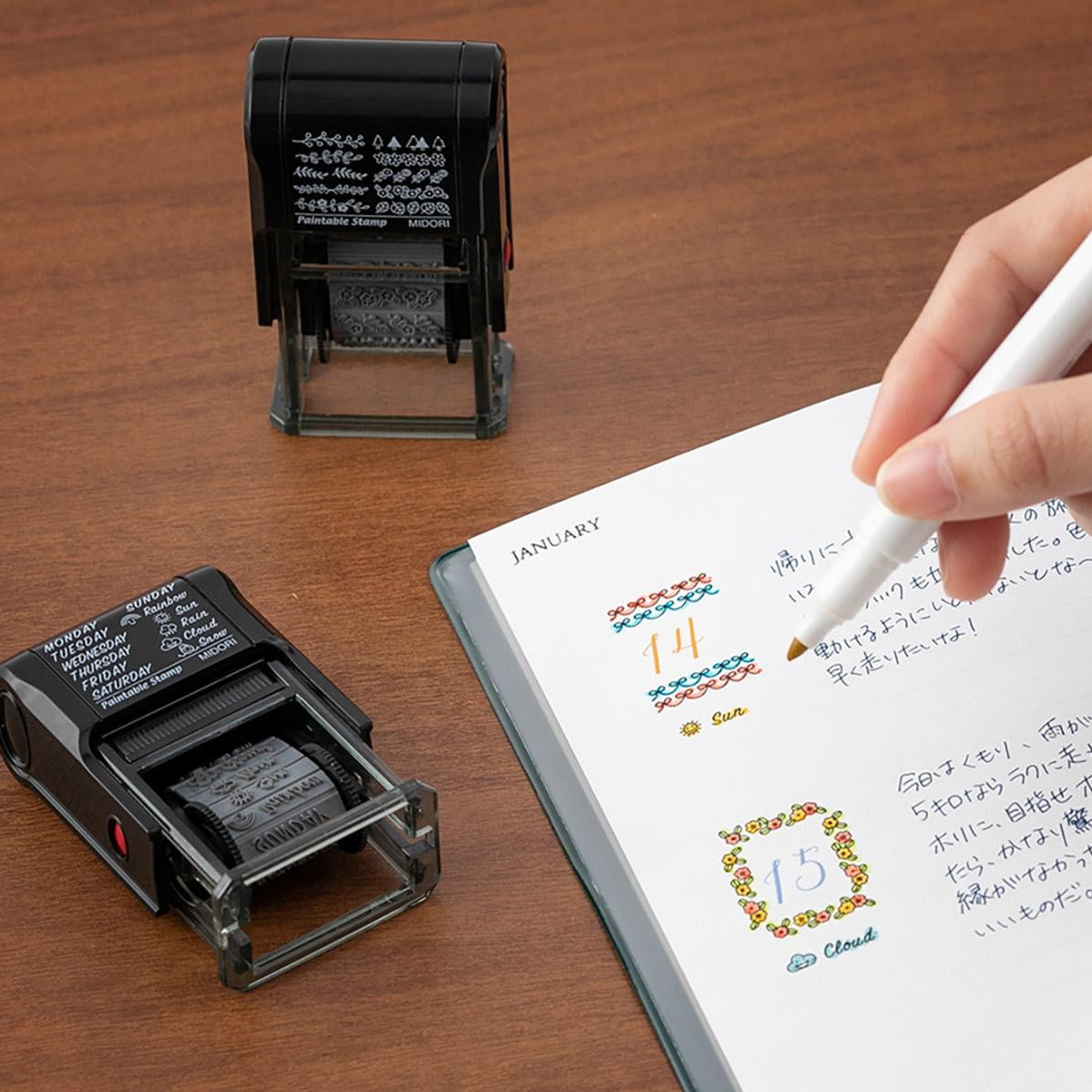 Midori Pre-Inked Paintable Stamp – 10 rotating decorative motifs including hearts, stars, ribbons and more. Waterproof black ink, no ink pad needed. Made in Japan.