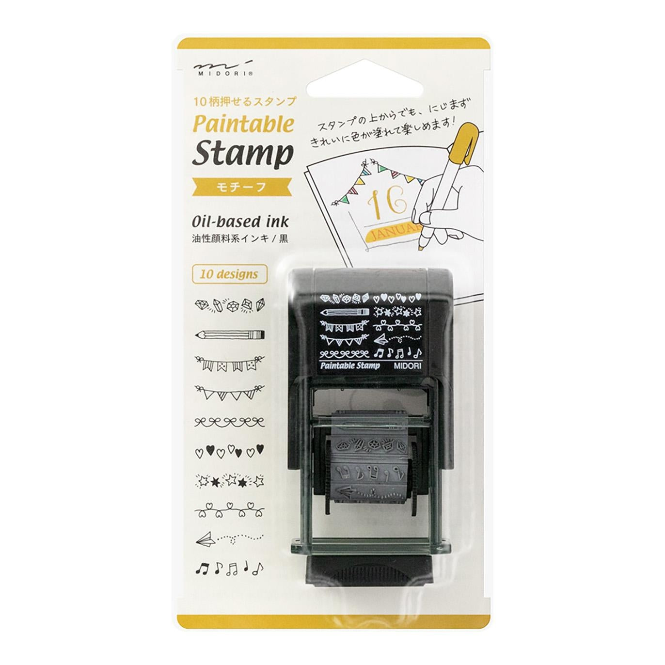 Midori Pre-Inked Paintable Stamp – 10 rotating decorative motifs including hearts, stars, ribbons and more. Waterproof black ink, no ink pad needed. Made in Japan.