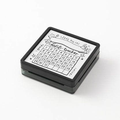 Midori pre-inked habit tracker stamp with monthly grid layout, black ink design, paintable journal stamp for tracking habits