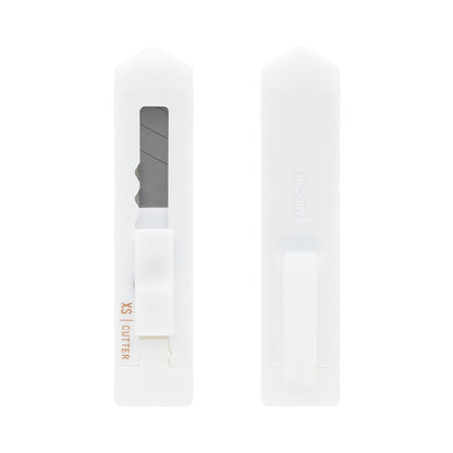 Midori XS white cutter beside its cap