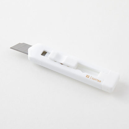 Midori XS white cutter with blade extended