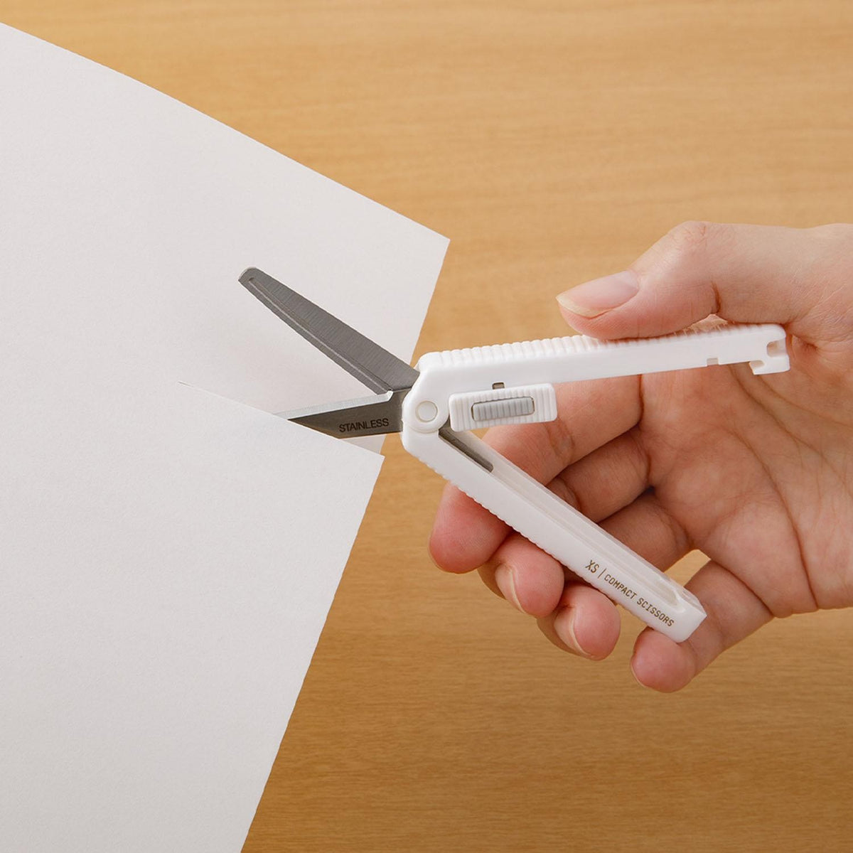 Midori XS white scissors cutting paper