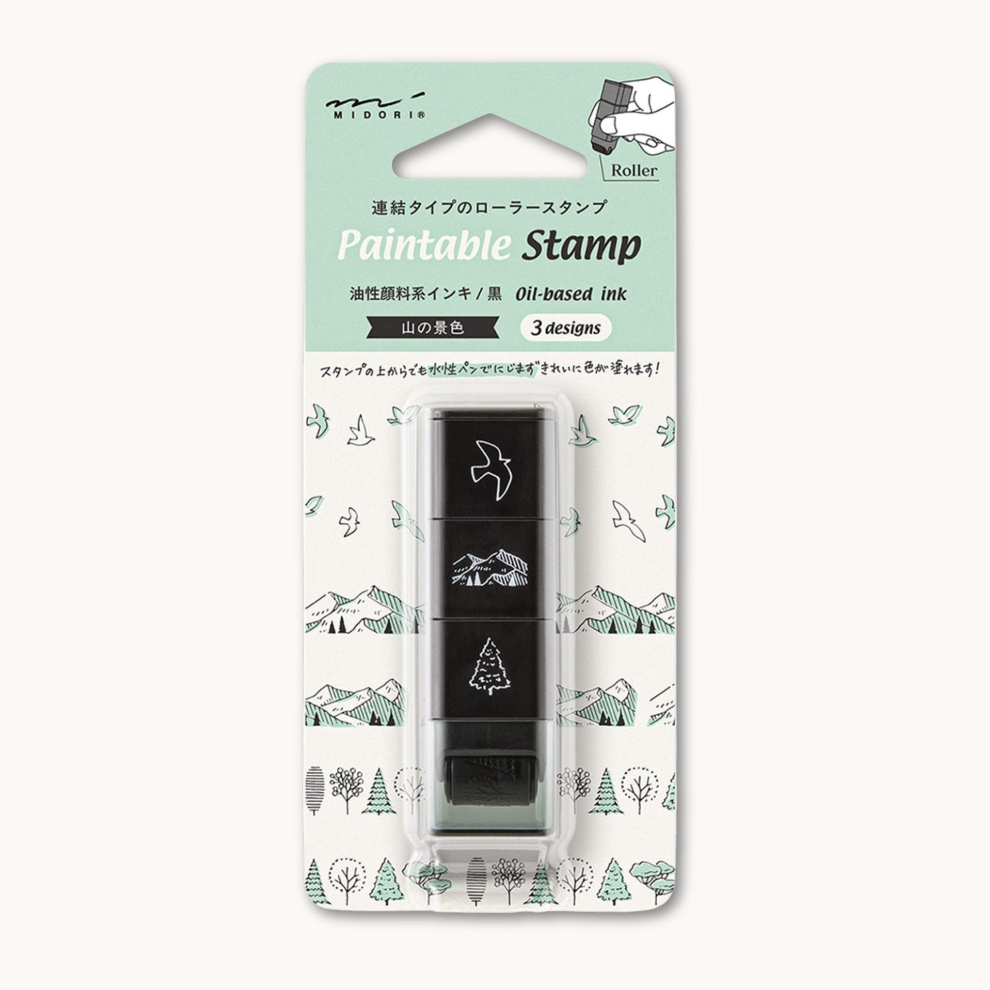 Midori roller stamp with mountain, tree and bird patterns, continuous pre-inked design, paintable Japanese stationery stamp