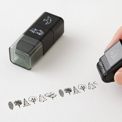 Midori roller stamp with mountain, tree and bird patterns, continuous pre-inked design, paintable Japanese stationery stamp