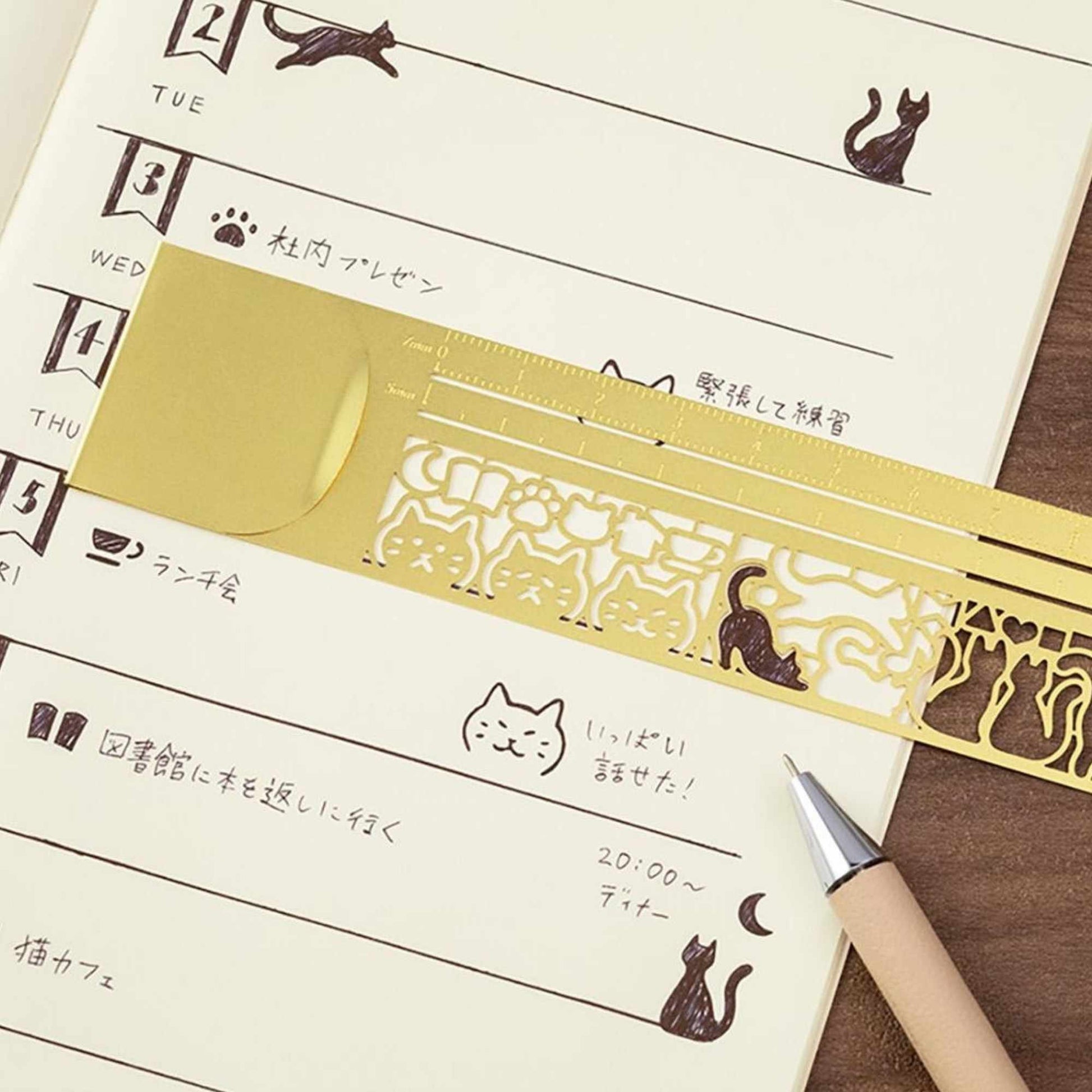 Midori Clip Ruler Cat featuring cat-themed stencil cut-outs in brass