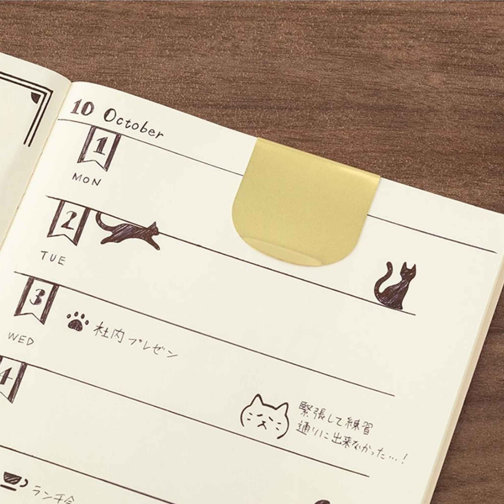 Midori Clip Ruler Cat featuring cat-themed stencil cut-outs in brass