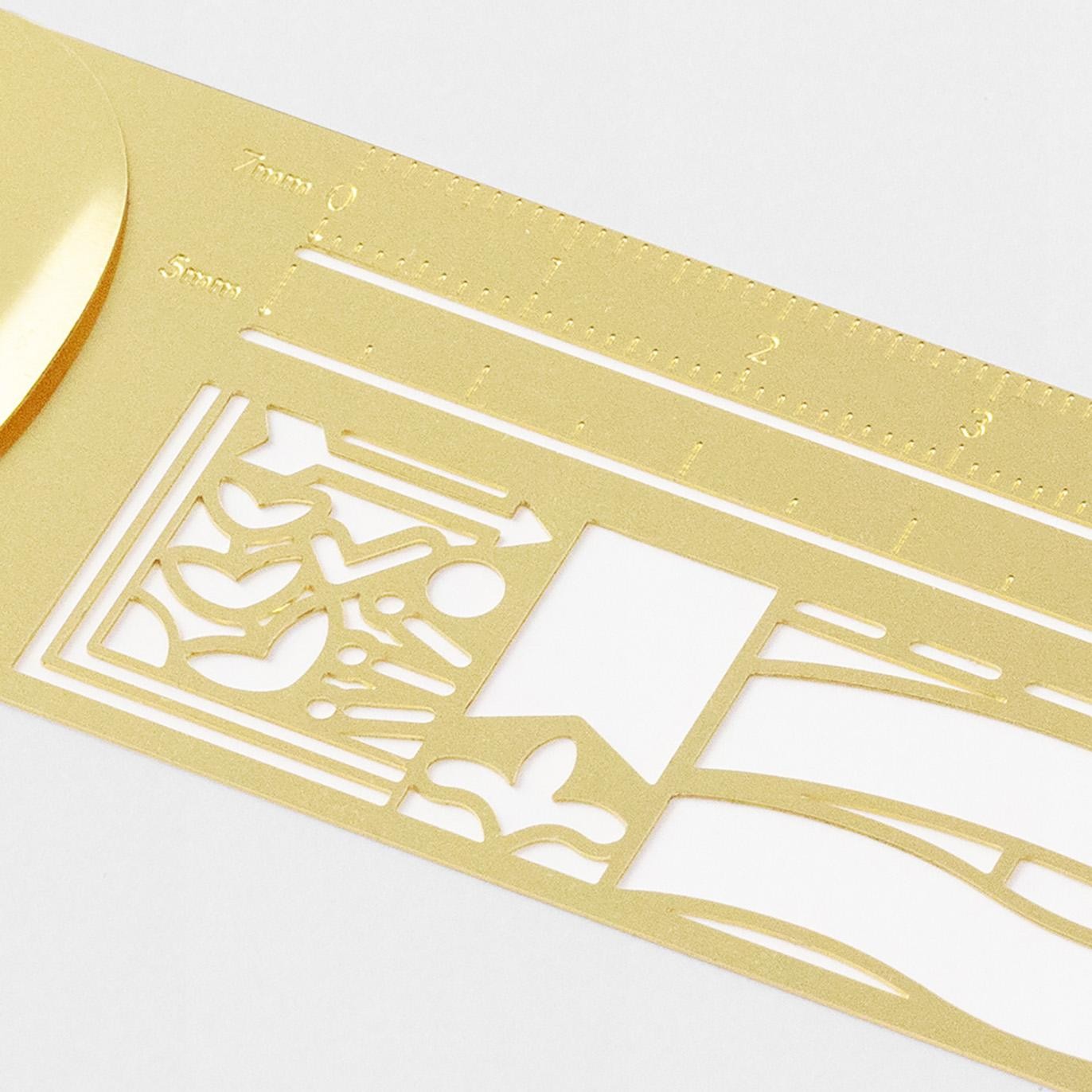 Midori brass clip ruler with decorative pattern, ultra-thin metal design and template cut-outs for journaling and planners