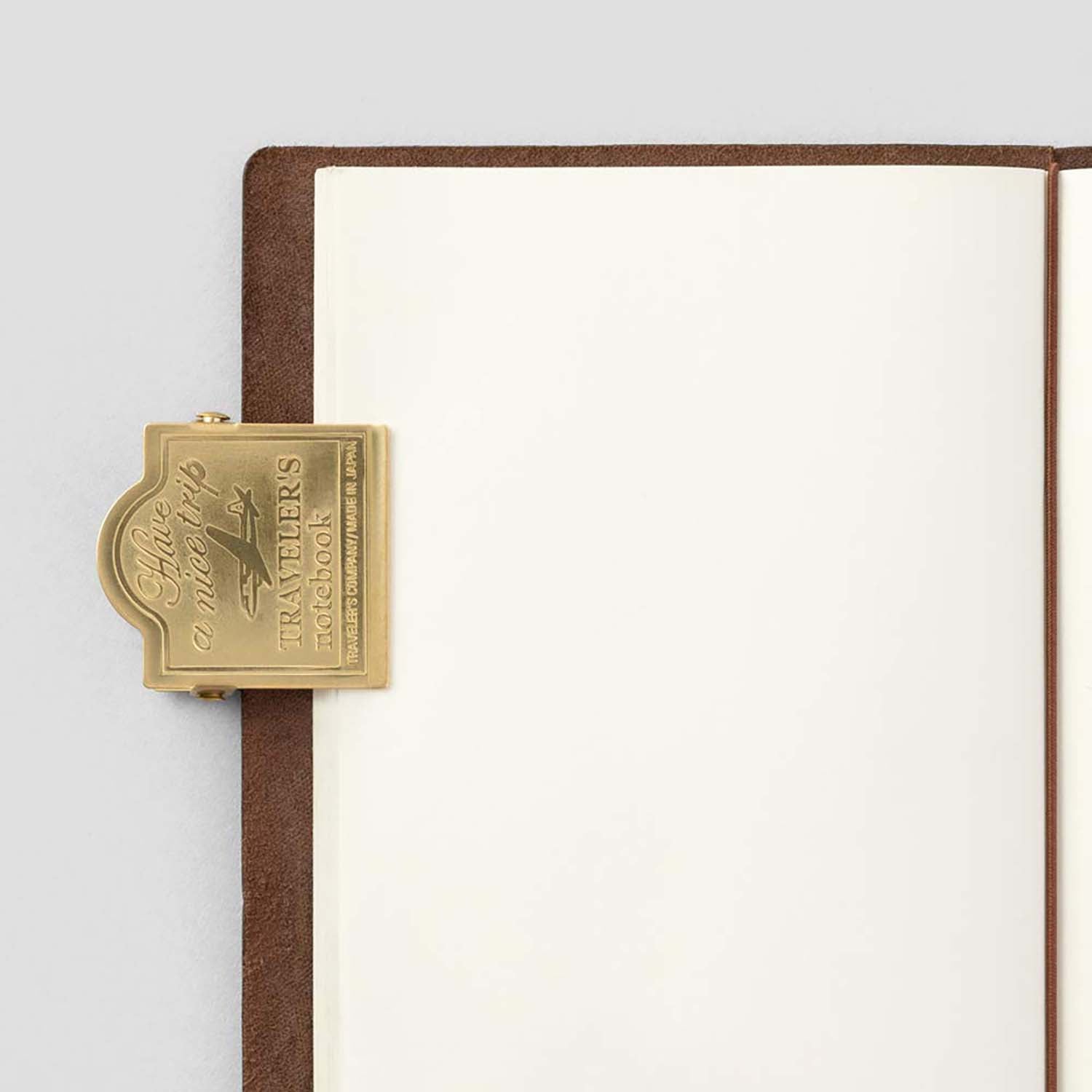 TRC Brass Clip – Airplane edition, engraved with “Have a nice trip” and airplane design