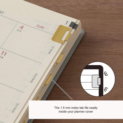 Midori Chiratto small brass index clips marking planner pages, with English feature captions