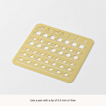 Midori Medium brass calendar stencil viewed at an angle, with English feature captions