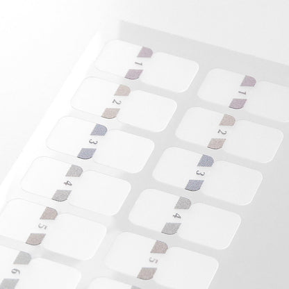 Close-up of Midori Chiratto grey number index tabs