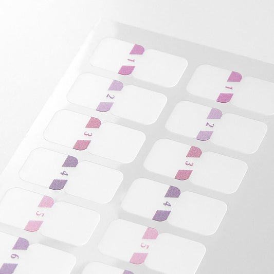 Close-up of Midori Chiratto pink number index tabs