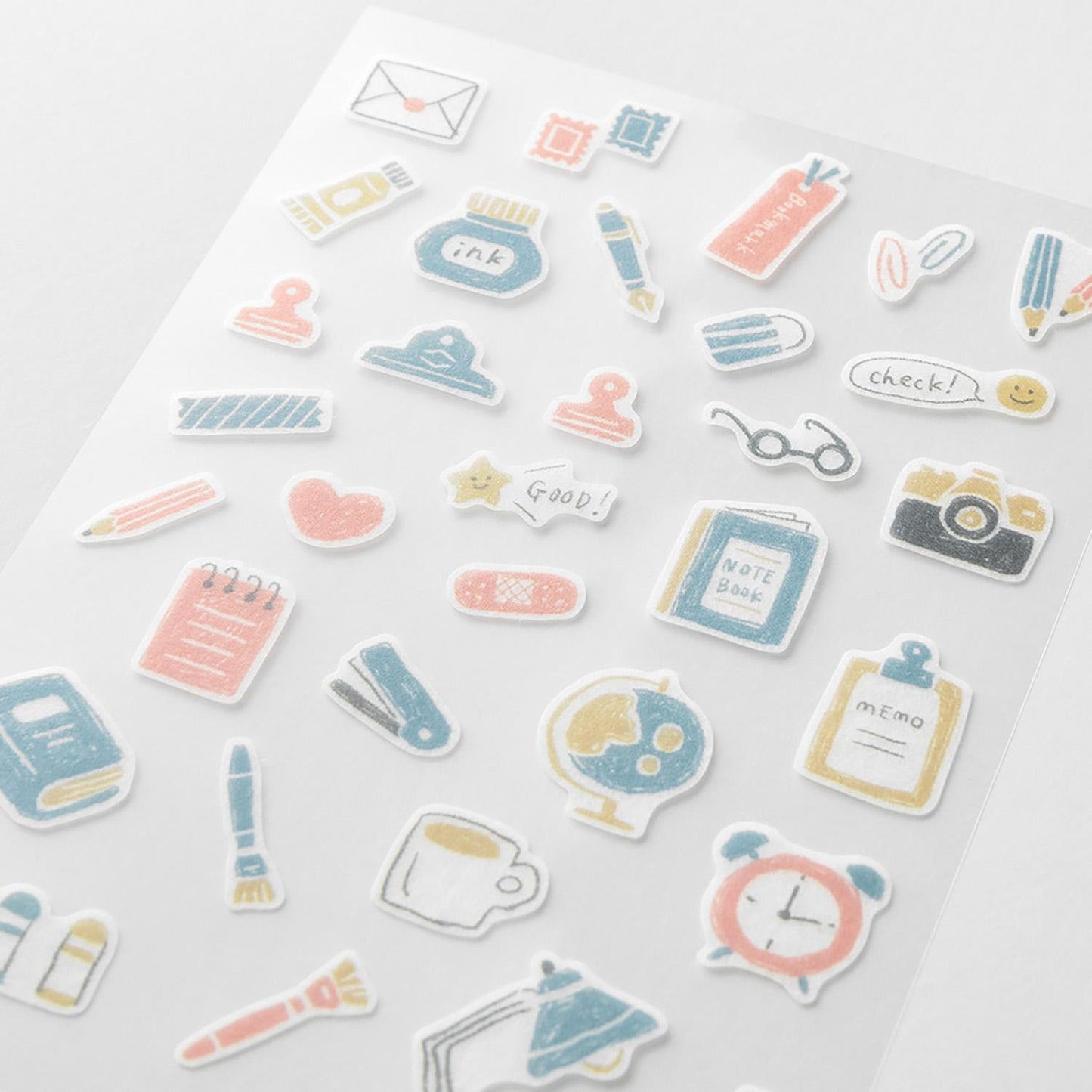 Midori Japanese stationery-themed washi sticker sheets with pens, notebooks, clips, and desk items in soft pastel tones