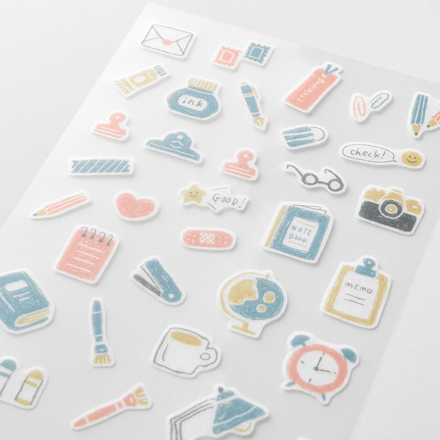 Midori Japanese stationery-themed washi sticker sheets with pens, notebooks, clips, and desk items in soft pastel tones