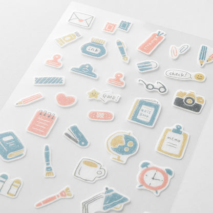 Midori Japanese stationery-themed washi sticker sheets with pens, notebooks, clips, and desk items in soft pastel tones
