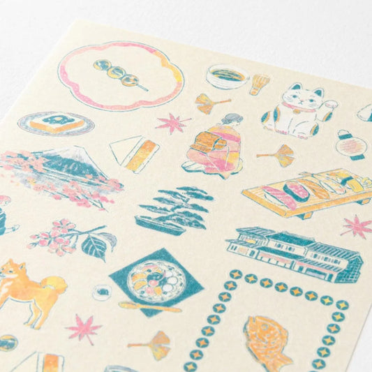 Midori travel series Japanese motifs washi sticker sheet with tea, sweets, lucky cats, seasonal scenes, and traditional illustrations