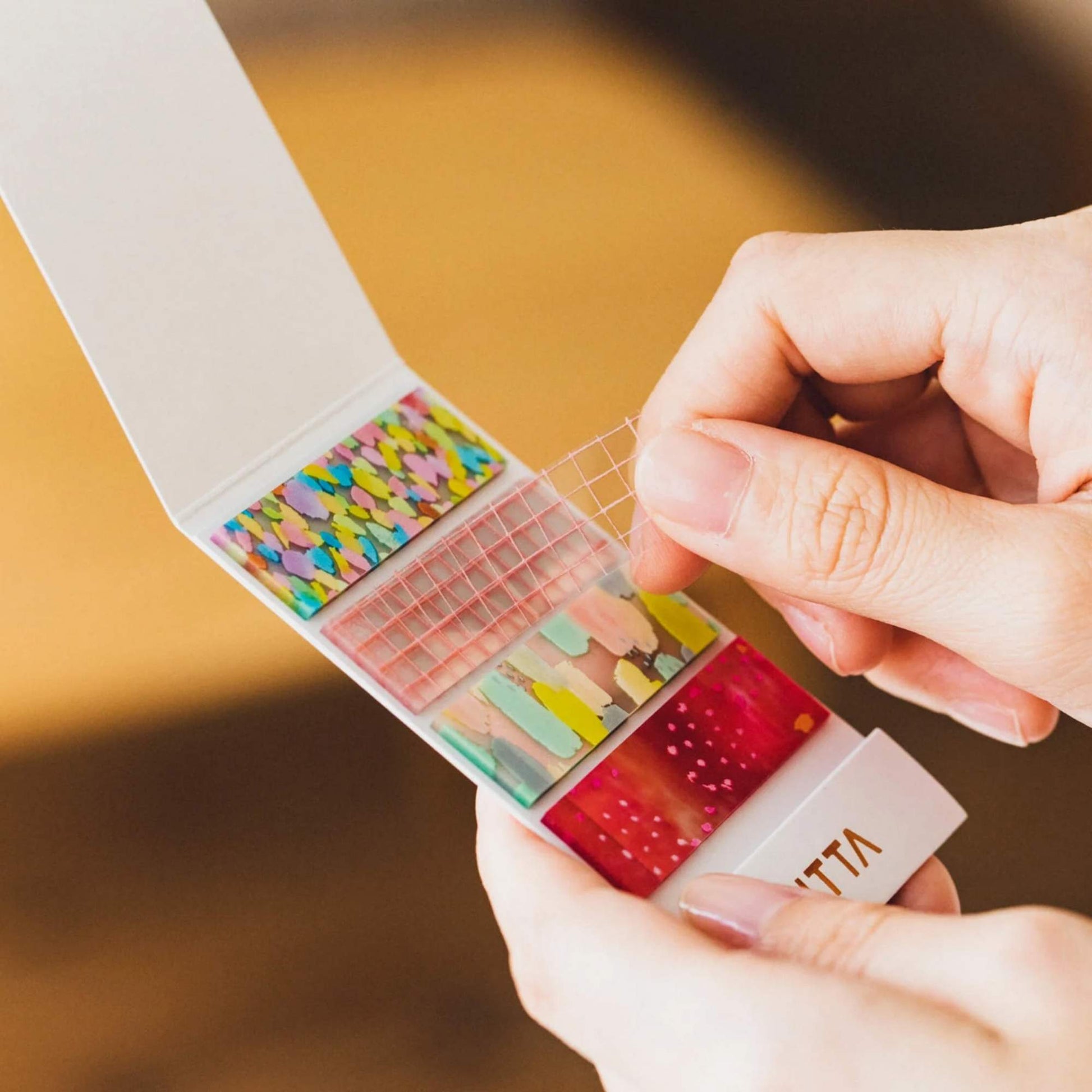 KITTA Clear PET Tape - Confetti booklet with four colourful transparent PET strip designs
