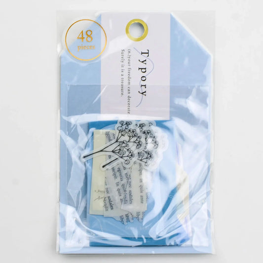 Q-Lia Typory Flake Stickers – Light Blue featuring 48 stickers in 18 unique designs on tracing and opaque paper 