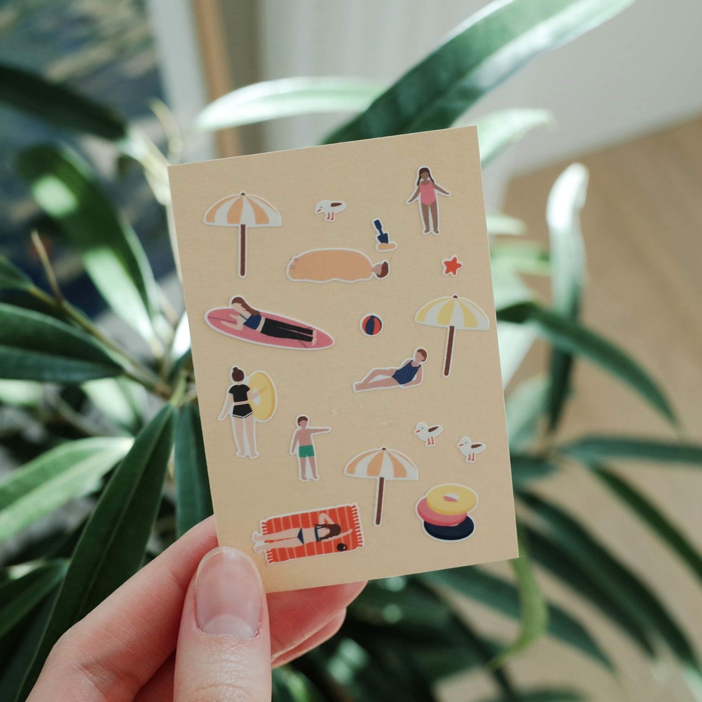 Suatelier Swim Swim sticker sheet featuring beach scenes, swimmers, surfboards, umbrellas and summer holiday illustrations.