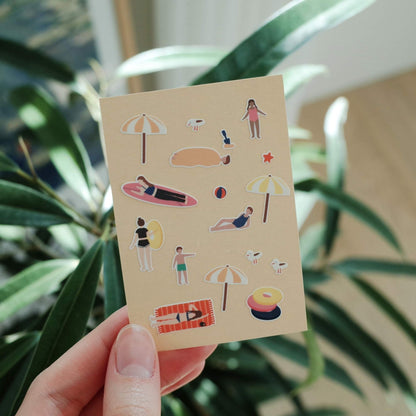 Suatelier Swim Swim sticker sheet featuring beach scenes, swimmers, surfboards, umbrellas and summer holiday illustrations.